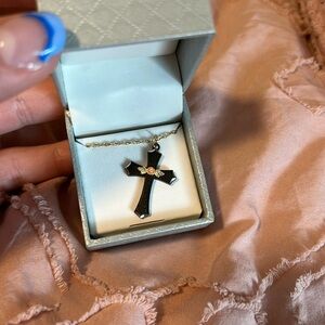 - Gold cross necklace